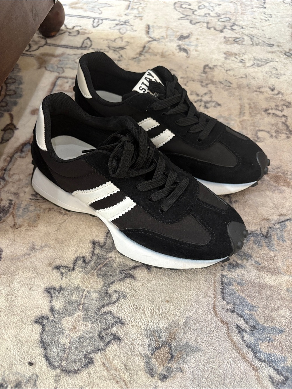 Black Sneakers with White Stripes